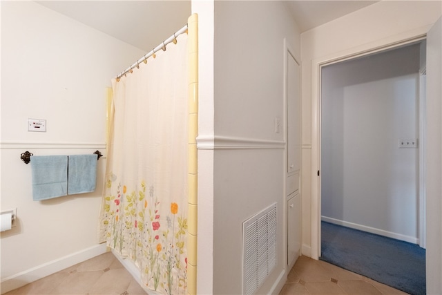 bathroom with tile patterned floors