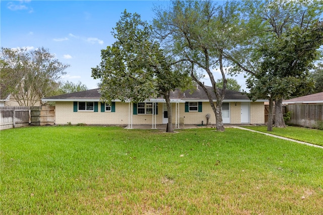 view of front of house featuring a garage and a front lawn