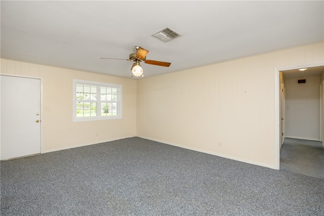 carpeted empty room featuring ceiling fan