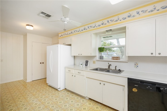 kitchen featuring sink, ceiling fan, white cabinets, white refrigerator, and black dishwasher