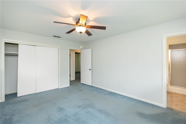 unfurnished bedroom with ceiling fan, a closet, and carpet