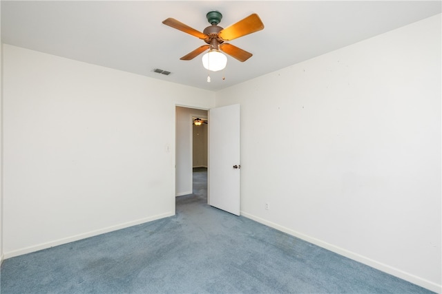 carpeted empty room with ceiling fan