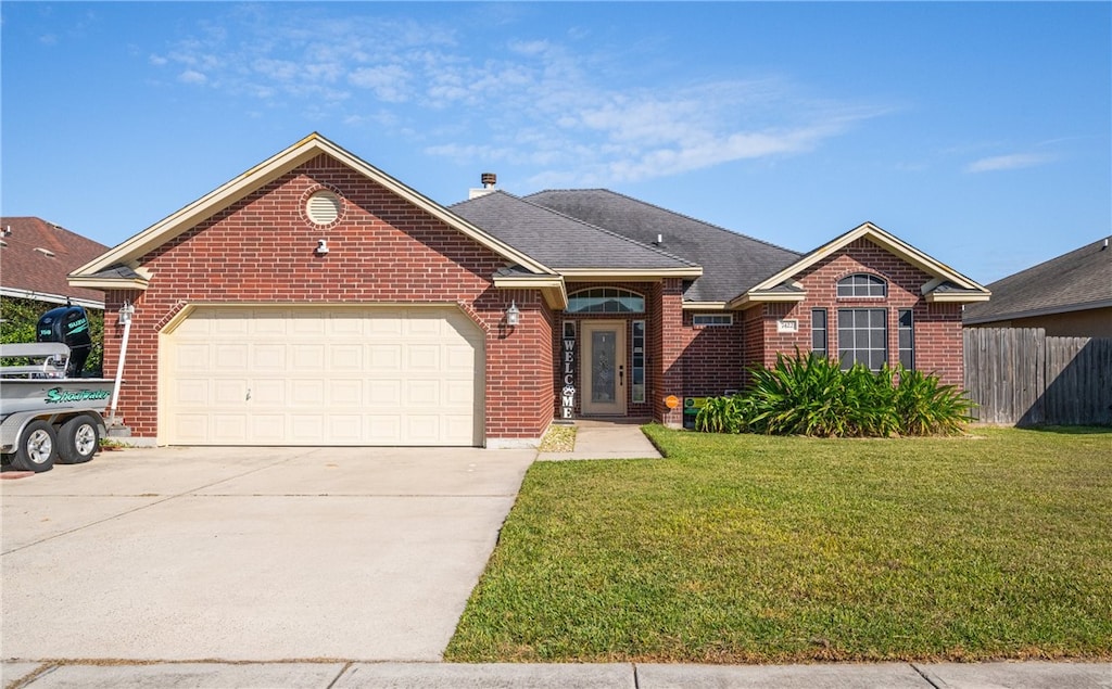 7422 Trail Creek Dr, Corpus Christi, TX 78414 - single story home featuring brick siding, driveway, a front yard, and fence