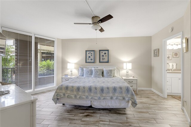 bedroom with ceiling fan and ensuite bath