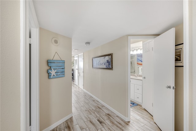 corridor featuring light hardwood / wood-style flooring