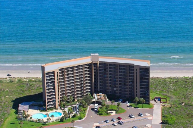 bird's eye view featuring a water view and a view of the beach