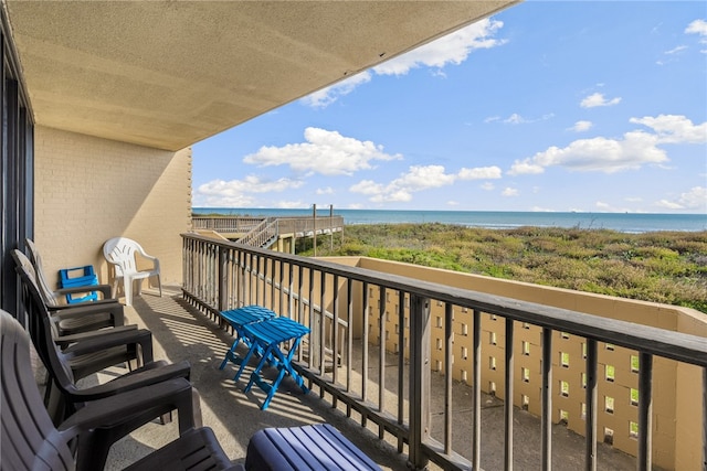 balcony featuring a water view