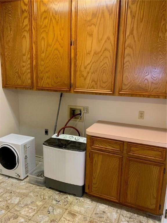 washroom featuring cabinets, electric dryer hookup, and hookup for a washing machine