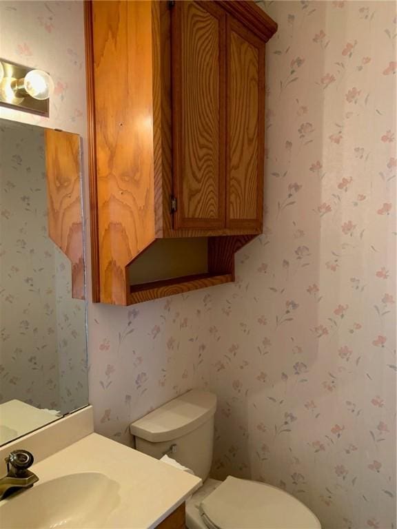 bathroom with vanity and toilet