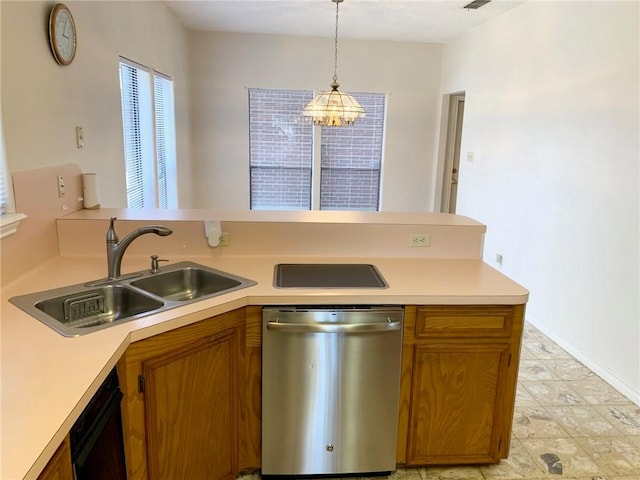 kitchen with a sink, light countertops, and stainless steel dishwasher