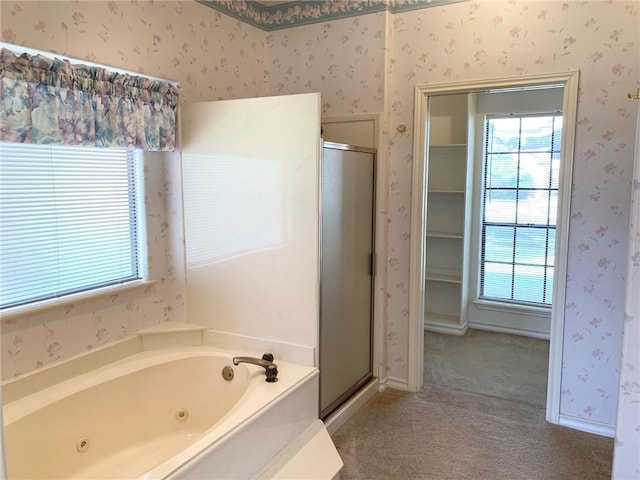 full bath featuring wallpapered walls, a shower stall, a tub with jets, and baseboards