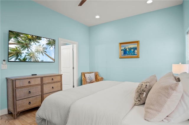 bedroom featuring ceiling fan and light hardwood / wood-style flooring