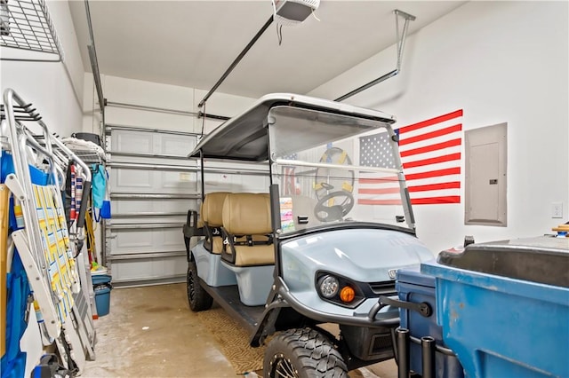 garage featuring a garage door opener and electric panel