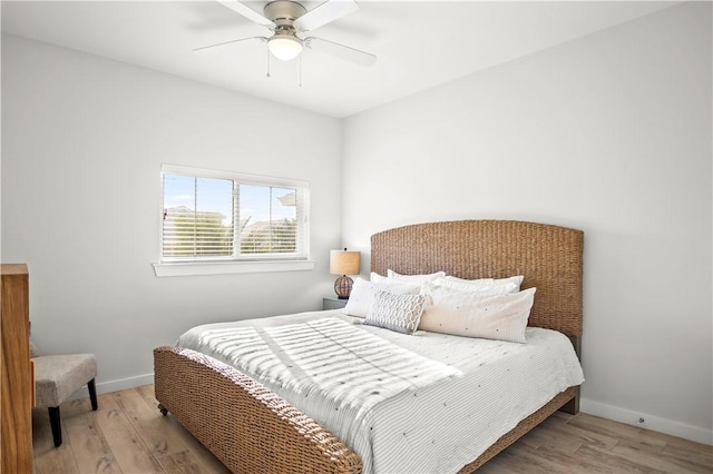 bedroom featuring light hardwood / wood-style flooring and ceiling fan