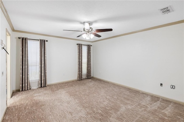 carpeted empty room with crown molding and ceiling fan