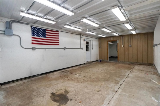 garage featuring wood walls