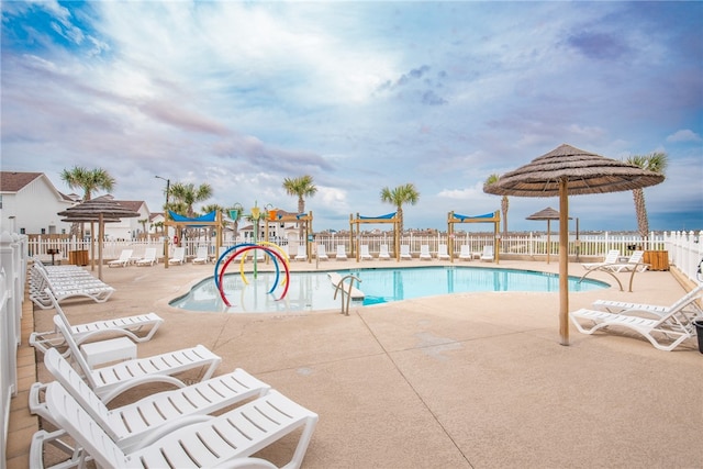 view of swimming pool featuring a patio area