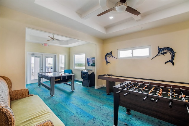 playroom featuring beamed ceiling, french doors, carpet flooring, and ceiling fan