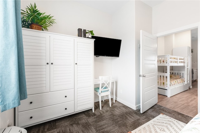 bedroom with dark wood-type flooring