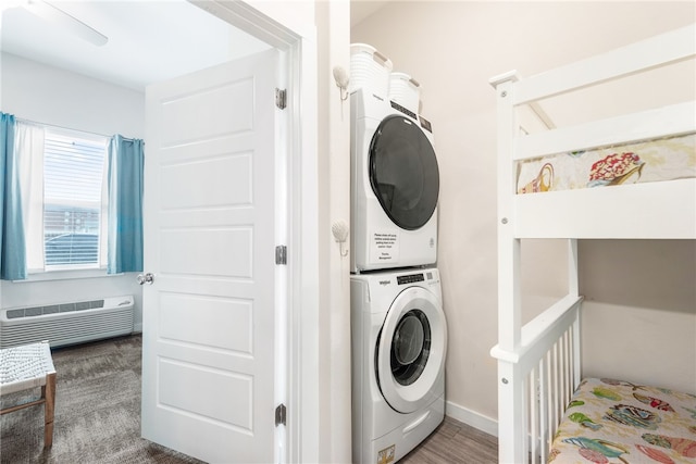 laundry area featuring stacked washer and clothes dryer