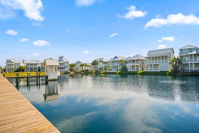 dock area featuring a water view and a residential view