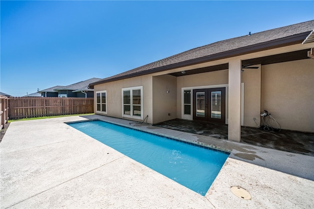 view of pool featuring french doors and a patio