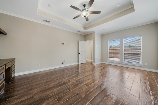 unfurnished living room with dark hardwood / wood-style flooring, ceiling fan, and a raised ceiling