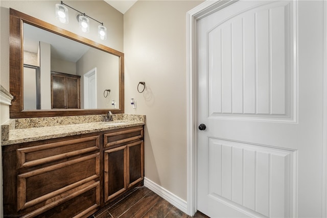 bathroom featuring hardwood / wood-style floors and vanity