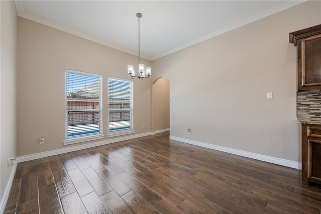 unfurnished dining area with dark wood-type flooring, crown molding, and a notable chandelier