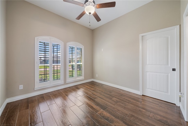 spare room with ceiling fan and dark hardwood / wood-style flooring