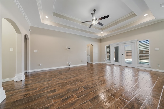 spare room with french doors, dark wood-type flooring, crown molding, and a tray ceiling