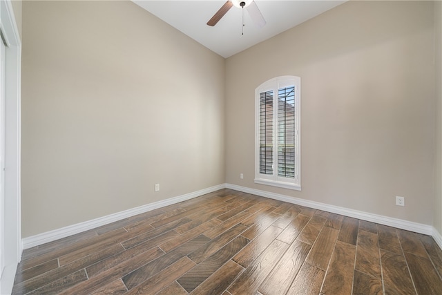 unfurnished room featuring dark hardwood / wood-style floors, ceiling fan, and vaulted ceiling