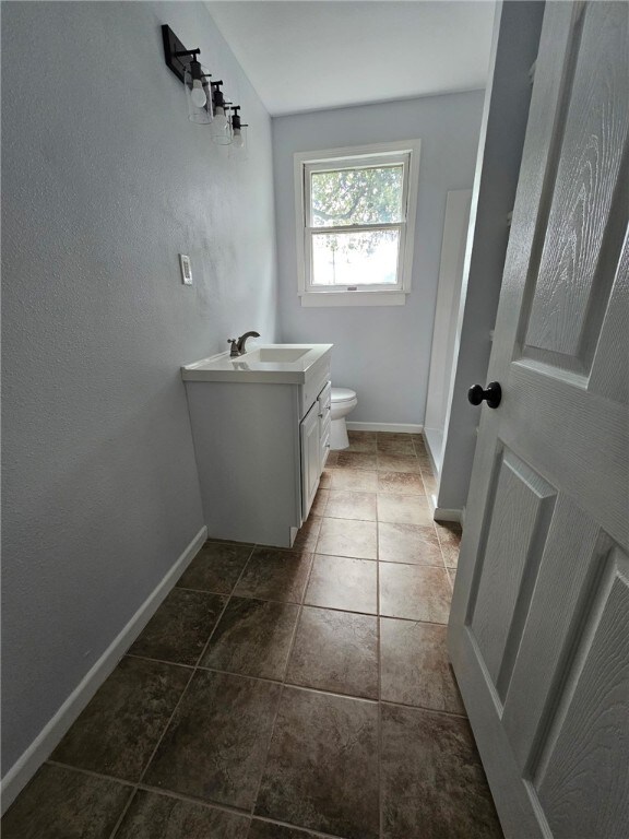 2802 Devon Dr, Corpus Christi, TX 78404 - bathroom with toilet and vanity