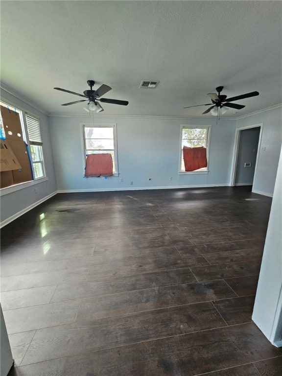 2802 Devon Dr, Corpus Christi, TX 78404 - unfurnished room with dark wood-type flooring, ceiling fan, a textured ceiling, and ornamental molding