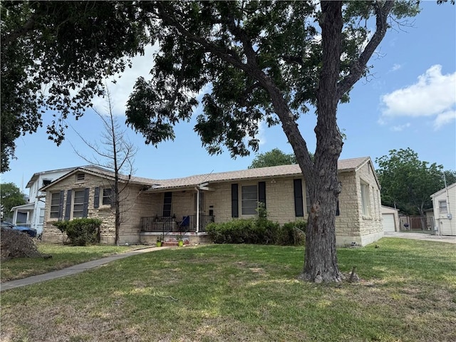 2802 Devon Dr, Corpus Christi, TX 78404 - ranch-style home featuring stone siding and a front lawn