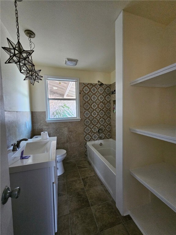 2802 Devon Dr, Corpus Christi, TX 78404 - bathroom with vanity and washtub / shower combination
