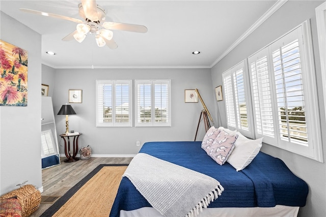4820 Sanibel Ln, Port Aransas, TX 78373 - bedroom featuring ornamental molding, a ceiling fan, multiple windows, and wood finished floors