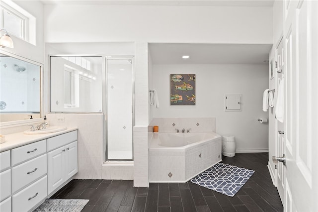 4820 Sanibel Ln, Port Aransas, TX 78373 - bathroom with wood finished floors, vanity, a shower stall, and a bath