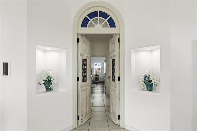 4820 Sanibel Ln, Port Aransas, TX 78373 - corridor with light tile patterned floors and baseboards