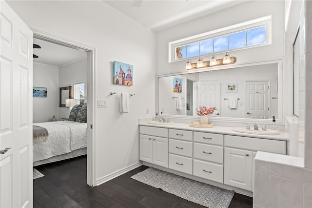4820 Sanibel Ln, Port Aransas, TX 78373 - ensuite bathroom with wood finished floors, a wealth of natural light, and a sink