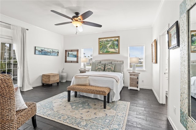 4820 Sanibel Ln, Port Aransas, TX 78373 - bedroom featuring ornamental molding, dark wood-type flooring, ceiling fan, and baseboards