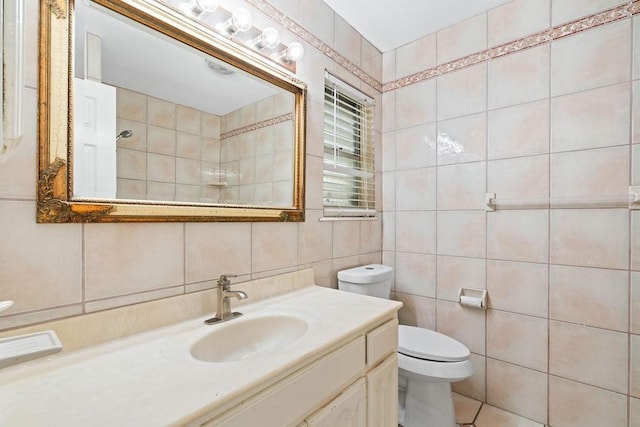 bathroom featuring tile walls, tasteful backsplash, walk in shower, vanity, and toilet