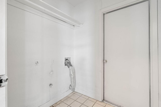laundry room with hookup for an electric dryer, light tile patterned floors, laundry area, and washer hookup
