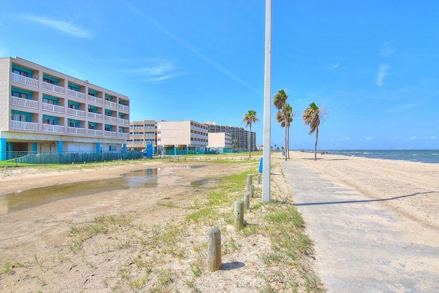 view of street featuring a view of the beach and a water view