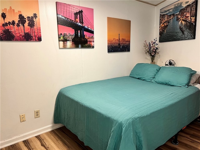 bedroom featuring hardwood / wood-style flooring