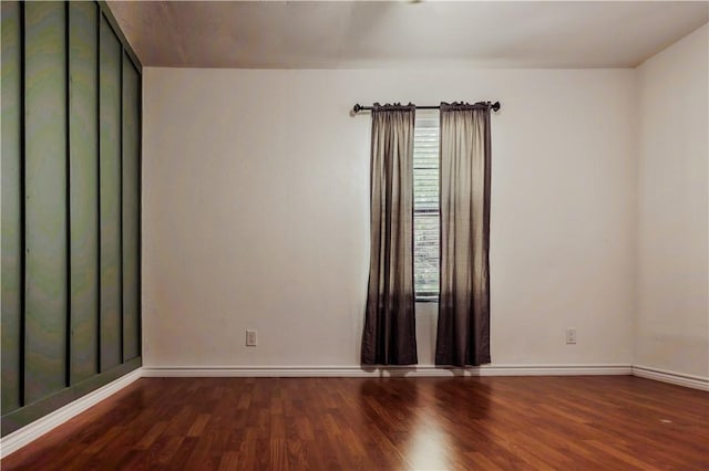 112 E 6th St, Bishop, TX 78343 - spare room featuring baseboards, wood finished floors, and plenty of natural light