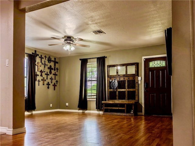 112 E 6th St, Bishop, TX 78343 - interior space featuring wood finished floors, a textured ceiling, ceiling fan, and visible vents