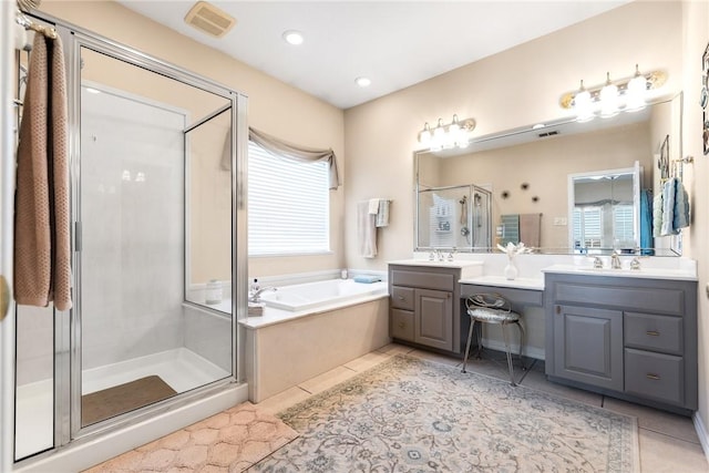 full bathroom featuring tile patterned floors, a shower stall, a bath, vanity, and recessed lighting