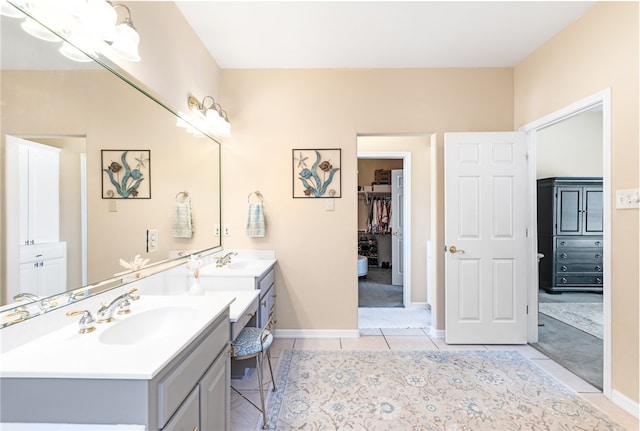 bathroom featuring tile patterned flooring and vanity