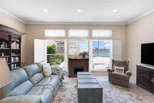 tiled living area featuring crown molding, healthy amount of natural light, a fireplace, and recessed lighting